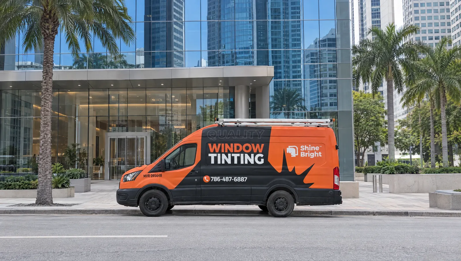 Shine Bright window tinting van parked outside a glass office building downtown