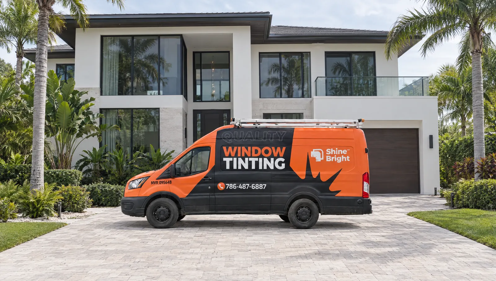 Shine Bright window tinting van in the driveway of a modern South Florida home
